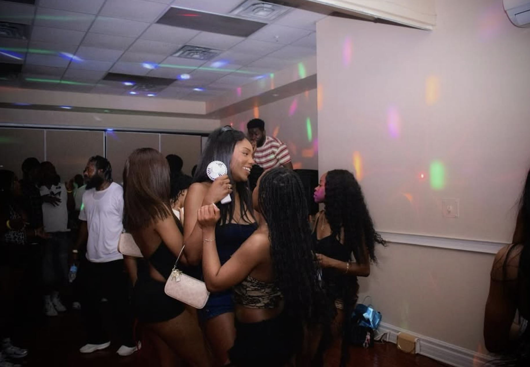 Aura Salad crowd with party lights